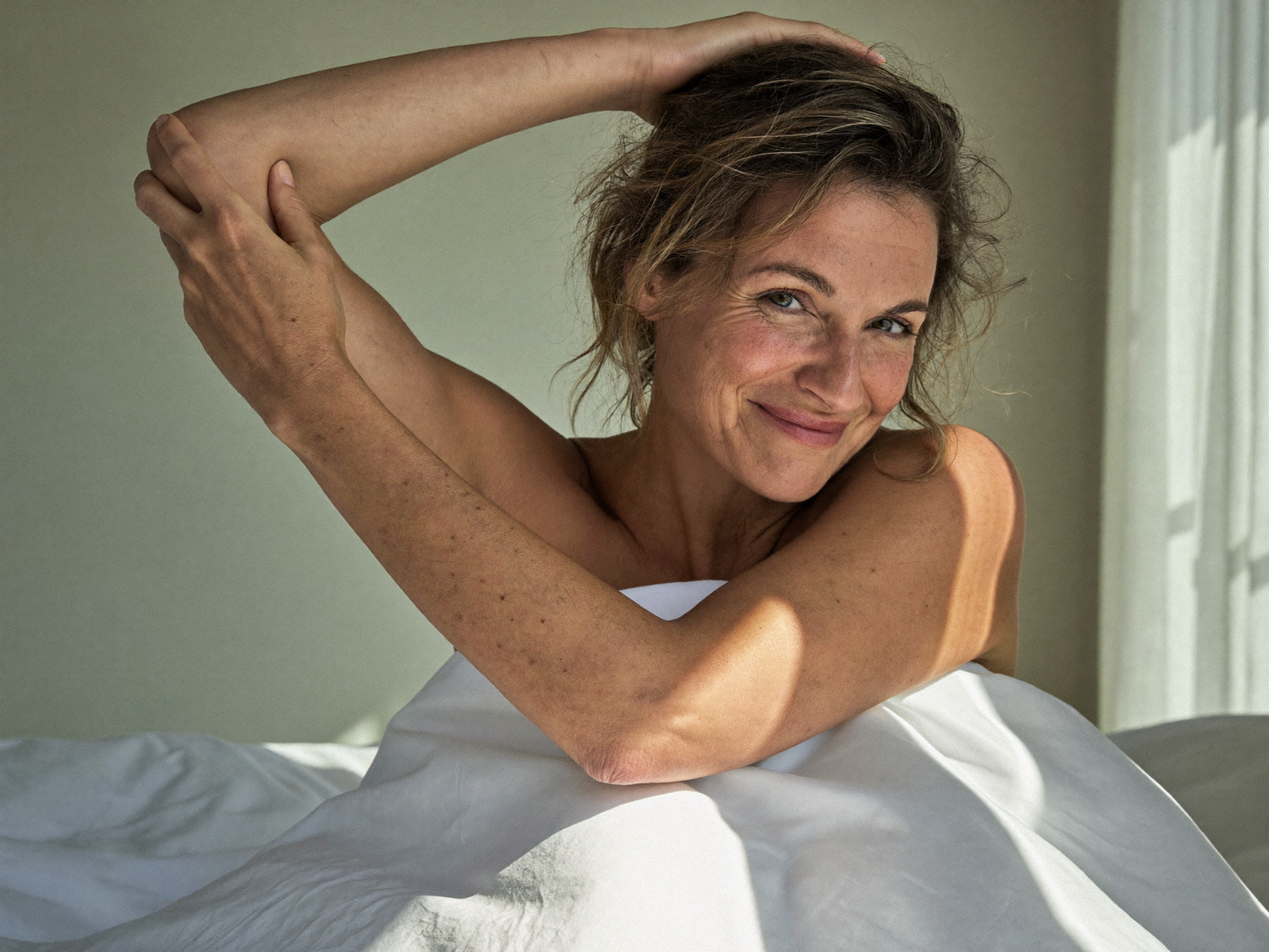 Woman waking up rested and refreshed